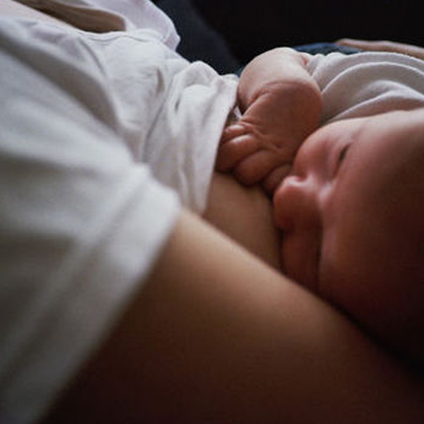 Mother breastfeeding her newborn baby